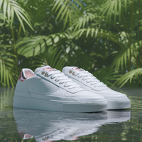 Saved white sneaker preview against green leaves.