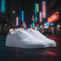 Saved white sneaker preview against a blurred neon street at night.